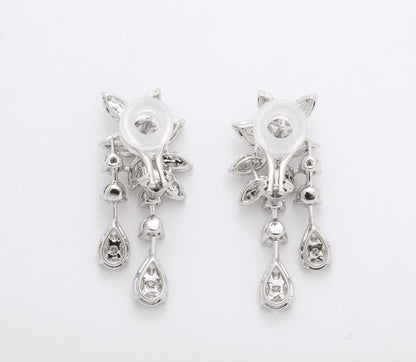 https://a.1stdibscdn.com/diamond-cluster-dangle-earring-for-sale-picture-9/j_415/j_160698521655143269320/6R1A1383_master.jpg?width=768